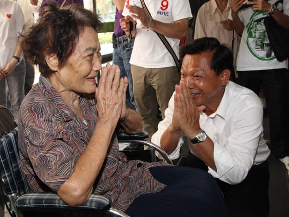 Pheu Thai Party`s Bangkok governor candidate Pongsapat Pongcharoen greets his supporter during a campaign for the city’s leader seat in Bangkok,Thailand on the eve of the voting.