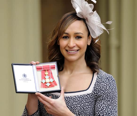 Olympic heptathlon champion Jessica Ennis poses for the media after she received her Commander of the British Empire (CBE) medal from Queen Elizabeth II during an Investiture ceremony at Buckingham Palace in London.