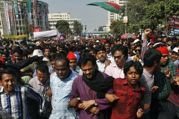Bangladeshi youth march through the streets as they celebrate the death sentence awarded to Jamaat-e-Islami leader Delwar Hossain Sayedee in Dhaka, Bangladesh.