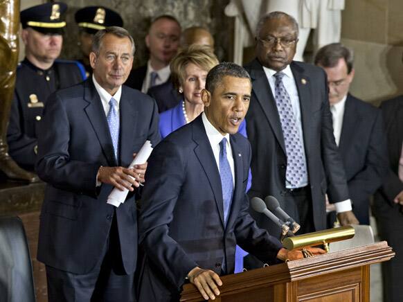President Barack Obama and congressional leaders set aside their political battles during a ceremony to dedicate a full-length statue of civil rights icon Rosa Parks.