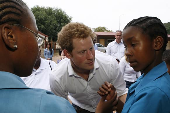 Britain`s Prince Harry meets children at the St. Bernadette School for the visually impaired in Maseru, Lesotho. Prince Harry is making a return trip to the southern African kingdom of Lesotho where he has long-standing personal charity interests.