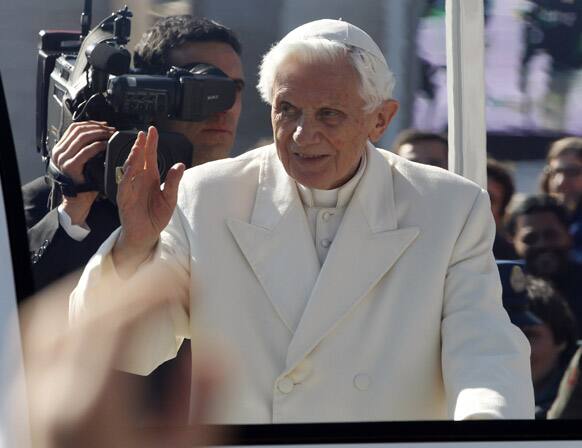 Pope Benedict XVI greets pilgrims in St. Peter`s Square at the Vatican. Pope Benedict XVI greeted the Catholic masses for the last time before retiring, making several rounds of the square as crowds cheered wildly and stopping to kiss a half-dozen children brought up to him by his secretary.