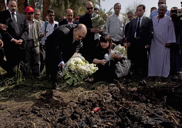 Japanese travel agent Okumura Hatsuko and Luxor`s Govornor Ezzat Saad lay flowers to pay respect to Japanese tourists that died from a hot air balloon accident, in Luxor, Egypt.
