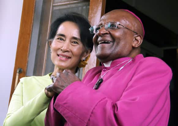 South African Archbishop Desmond Tutu and Myanmar opposition leader Aung San Suu Kyi smile during a press briefing after the Nobel laureates` meeting at her residence in Yangon, Myanmar.
