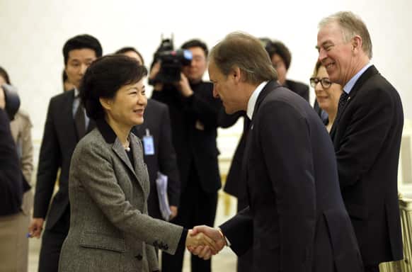 South Korean President Park Geun-hye, left, shakes hands with Britain`s Minister of State at the Foreign & Commonwealth Office Hugo Swire as Denmark`s Foreign Minister Villy Sovndal watches before their meeting at the presidential Blue House in Seoul, South Korea.