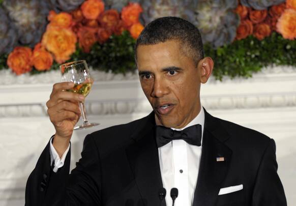 President Barack Obama offers up a toast as he welcomes the governors of the National Governors Association to the 2013 Governors’ Dinner at the White House in Washington.