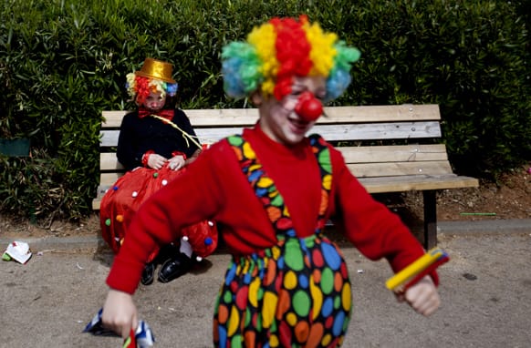 Two Ultra Orthodox Jewish boys dress as clowns during the Purim festival in the ultra-Orthodox town of Bnei Brak, Israel.