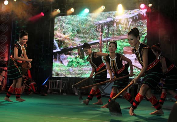 Kachin traditional artists troupe in traditional dress performs during a fund raising concert for refugees in Kachin state, at Myanmar Baptist Church Union in Yangon.