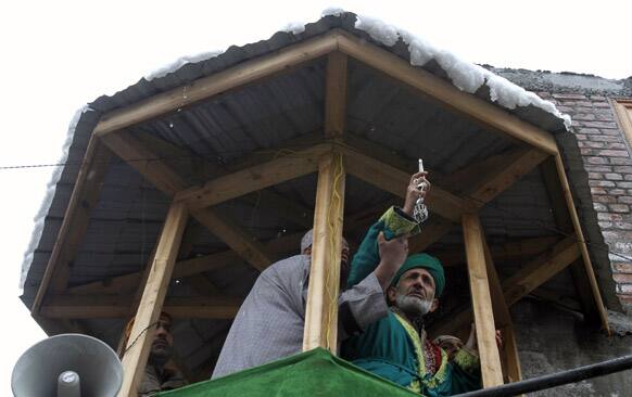 A Kashmiri head priest displays a relic of Syed Abdul Qadir Jilani, at his shrine in Srinagar. Thousands of devotees thronged to the Syed Abdul Qadir Jilani`s shrine which houses the relic of the saint, during an 11-day festival to mark the saint`s Urs.