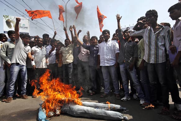 Activists of Akhil Bharatiya Vidyarthi Parishad (ABVP) shout slogans near an effigy representing the terrorist group