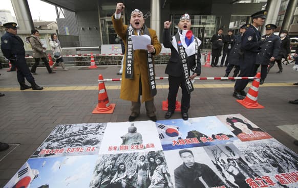 South Korean protesters shout slogans during a rally against Japan`s sovereignty that claims over the disputed islets in the Sea of Japan, outside South Korean Embassy in Tokyo.