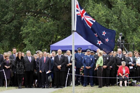 People pay their respects during a memorial service on the second anniversary of a deadly earthquake in Christchurch, New Zealand.