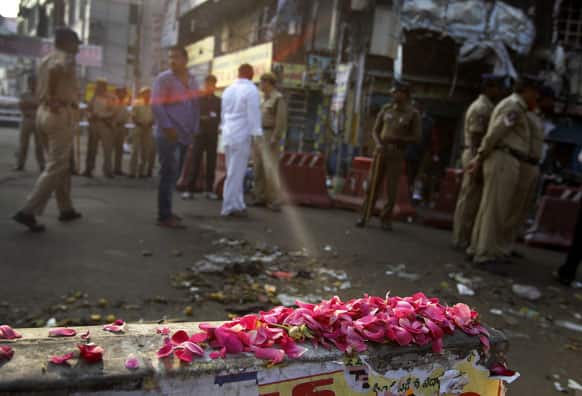 Flowers are placed in memory of those killed, at one of the two bomb blast sites, in Hyderabad.