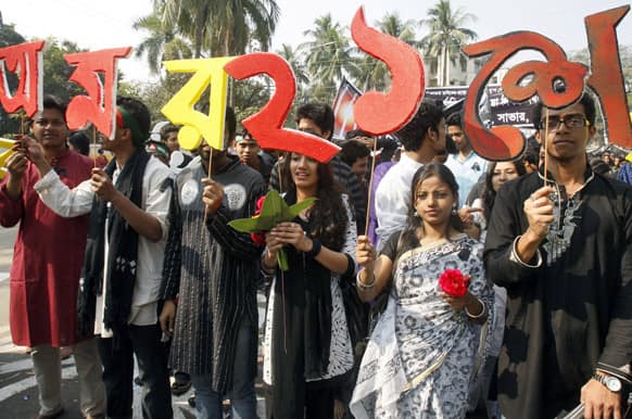 Bangladeshis hold letters of the Bangla language while participating in a rally to mark International Mother Language Day in Dhaka.