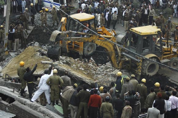 Rescuers perform search operations after a two storey building collapsed at the Tahirpur area in New Delhi. According to local news reports two persons were killed in the incident. The cause of the collapse is not yet known.