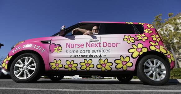 Tony Uzzi, Owner and General Manager of Nurse Next Door, Mission Viejo, poses for a picture at his car in Rancho Santa Margarita, Calif.