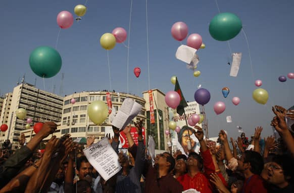 Bangladeshi protesters release balloons onto which letters written to the martyrs of the nation`s 1971 independence war against Pakistan have been attached in Dhaka.