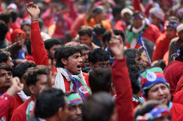 Indian railway porters shout slogans during a protest rally in New Delhi, India. The porters demanded regularization of jobs in the railways along with medical benefits.
