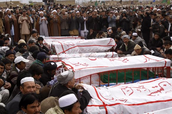 Pakistani Shiite Muslims attend funeral of the last weekend bombing victims in Quetta, Pakistan.