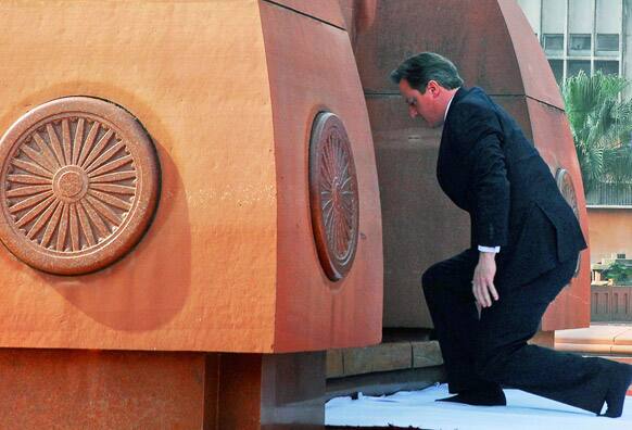 British Prime Minister David Cameron pays his respects at the site of a notorious 1919 massacre of hundreds of Indians by British colonial forces, in Amritsar.