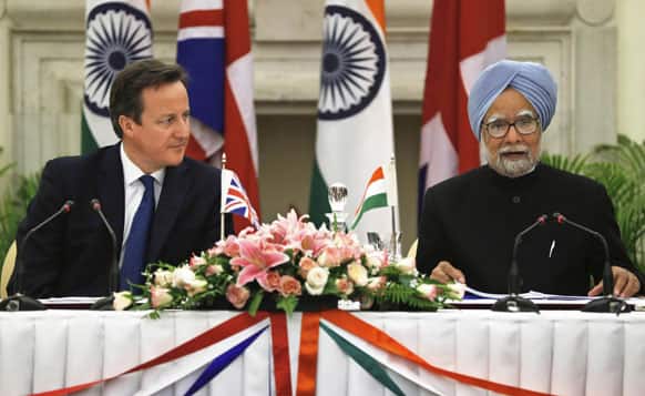 Prime Minister Manmohan Singh, address the media as British Prime Minister David Cameron listens at a joint press conference in New Delhi.