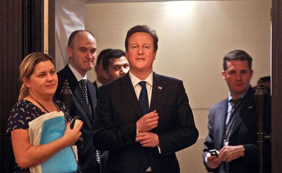 British Prime Minister David Cameron, arrives to deliver a speech at a business seminar in Mumbai.