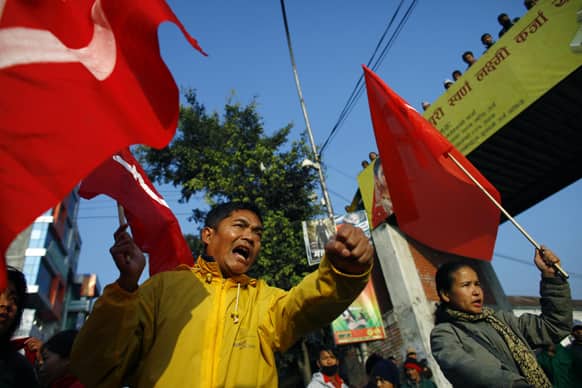 Members of the splinter faction of the Unified Communist Party of Nepal Maoist shout slogans during a general strike called by the party against the decision to form an interim government led by the Supreme Court chief justice in Katmandu.