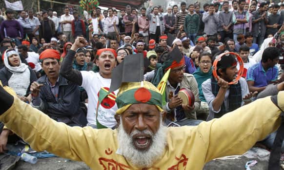 Bangladeshi people shout slogans against a nationwide general strike called by the country’s largest Islamic party in Dhaka.