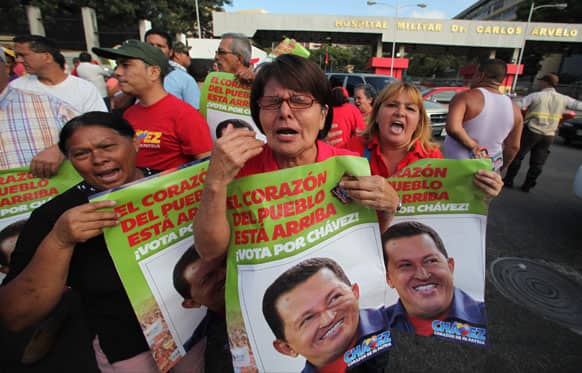 Supporters of Venezuela`s President Hugo Chavez celebrate his return to the country outside the military hospital in Caracas, Venezuela.
