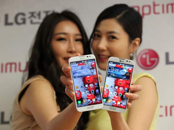 Models pose with LG Electronics` new smartphone Optimus G Pro during a press conference in Seoul, South Korea.