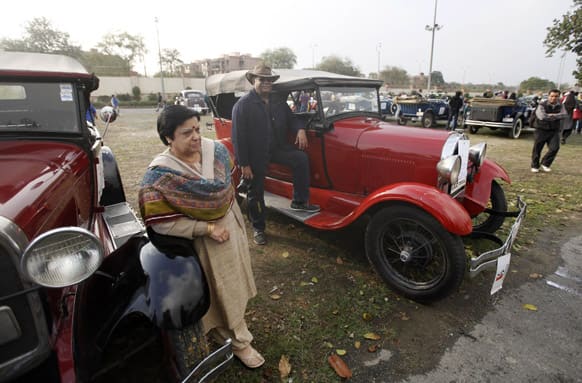 Owners pose with their vintage cars at the Statesman Vintage and Classic Car Rally in New Delhi.