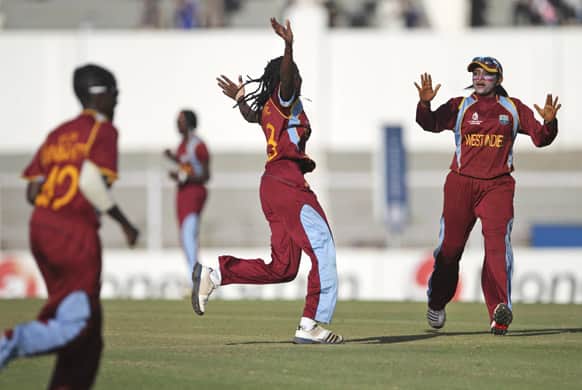 West Indies` players celebrate the dismissal of Australia`s Sarah Coyte, unseen, during the final match of the ICC Women`s World Cup cricket in Mumbai.