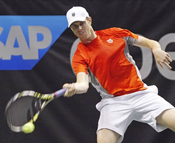 Sam Querrey hits a forehand during a semifinal match against Milos Raonic at the SAP Open tennis tournament in San Jose, Calif.