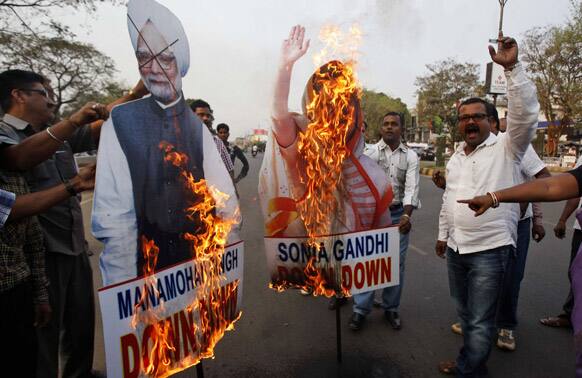 Activists of Bharatiya Janata Party burn effigies of Prime Minister Manmohan Singh and Chairperson of the United Progressive Alliance Sonia Gandhi during a protest in Bhubaneswar. The protest was against hike in fuel price.
