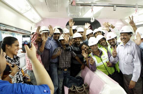 Officials of monorail along with passengers celebrate during the trial run in Mumbai. The Chembur-Wadala corridor will be the country’s first monorail route and is expected to be operational later this year.
