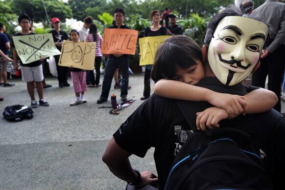Singaporeans gather at their speakers` corner in a protest against a paper passed in parliament last week that suggests continued immigration that would raise the total population to 6.9 million by 2030, a 30 percent increase in Singapore.