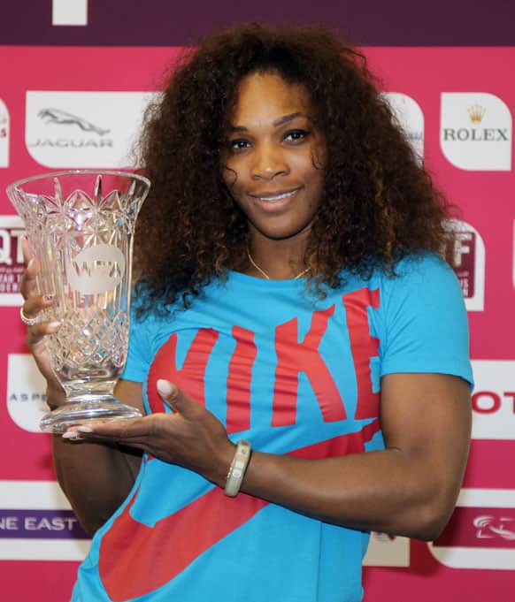 Serena Williams of the United States poses with a trophy given to her by the WTA Tour after the 31-year-old American reclaimed the world number one ranking following her WTA Qatar Open tennis quarter-final match against Czech Republic`s Petra Kvitova in the Qatari capital, Doha.