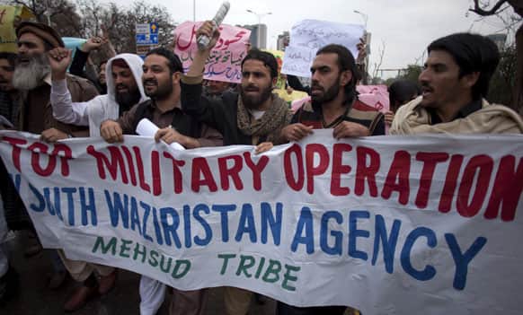 Pakistani tribal people from South Waziristan hold a rally in Islamabad. Dozens of protesters from Mehsud tribe gathered to condemn US drone attacks and ongoing military operations against Taliban and al-Qaida militants.