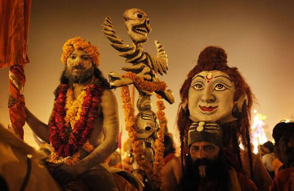 Naga Sadhus take out a procession to reach Sangam, confluence of Hindu holy rivers of Ganges, Yamuna and the mythical Saraswati, for a ritual dip, on the third and last royal bath of the Maha Kumbh festival on occasion of