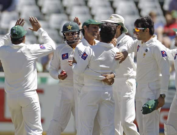 Pakistan team members react after taking the wicket of South African Alviro Petersen during a five day test against in Cape Town.