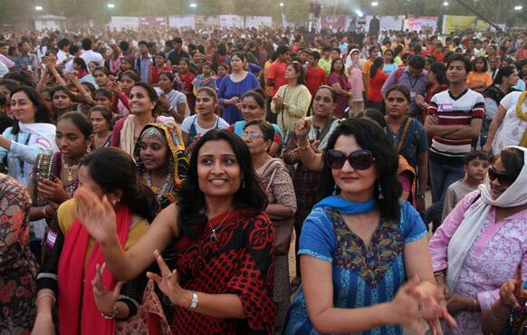 Women dance in an event to support the
