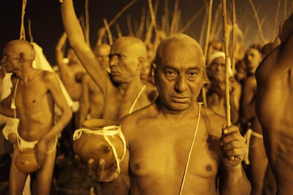 Hindu holy men of the Shree Niranjani Akhara participate in the rituals that is believed to rid them of all ties in this life and dedicate themselves to serving God as a