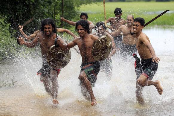 Sri Lankan traditional martial artists known as Angam fighters of the Ritigala chapter practice fighting skills during a training session in Ritigala, Sri Lanka.