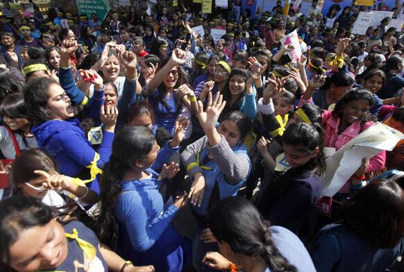 Indian girls dance as they take part in the