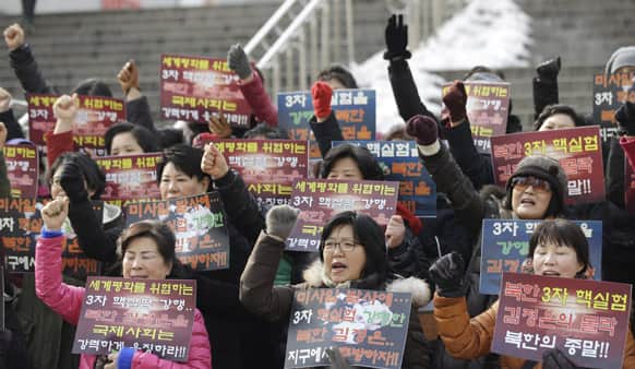 Anti-North Korean protesters shout slogans during a rally denouncing North Korea`s nuclear test in Seoul.
