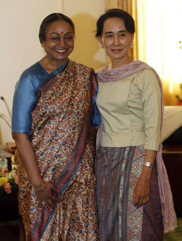 Myanmar opposition leader Aung San Suu Kyi poses for photo along with Indian parliamentary delegation leader Honourable Smt. Meira Kumar during their meeting at parliament building in Naypyitaw, Myanmar.