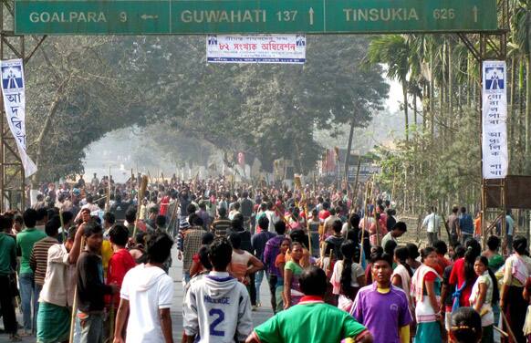 Members of the Rabha tribe stand with sticks and block a road as they protest a local government election in Goalpara ditrict, 120 kilometers (75 miles) from Gauhati, capital of the northeastern Indian state of Assam.