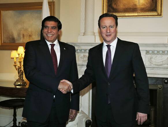 Britain`s Prime Minister David Cameron, shakes hands with Pakistan`s Prime Minister Raja Pervez Ashraf, prior to their meeting at his official residence at 10 Downing Street in central London.