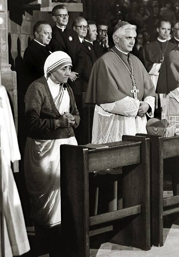 FILE - In this September 1978 file photo, Albanian-born Mother Teresa, left, and German Cardinal Joseph Ratzinger, right, attend a Mass during the 85th German Catholics Day in Freiburg, southern Germany, from Sept. 13-19, 1978. Ratzinger was elected Pope, April 19, 2005.