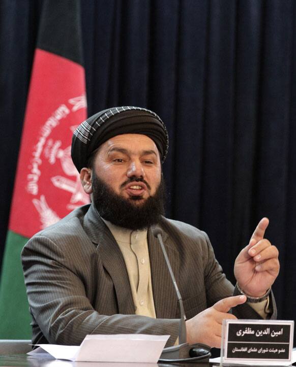 Aminullah Muzafery, a member of the Afghan delegation at peace talks between Pakistani and Afghan clerics, speaks during a press conference in Kabul.